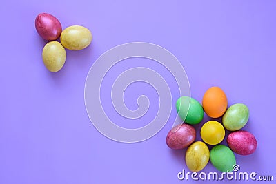 Easter beautiful eggs in the shape of flowers on a purple background Stock Photo