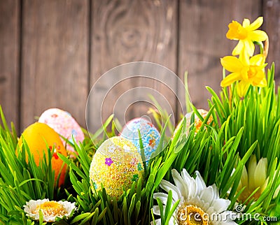 Easter border design. Colorful eggs in spring grass Stock Photo