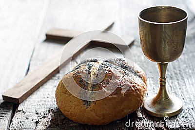 Easter bread wine and cross on vintage old wooden background Stock Photo