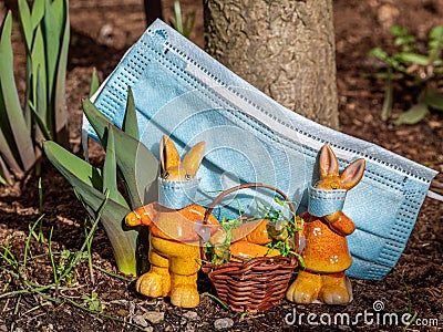 Easter bunnies with mouthguards in Corona times Stock Photo