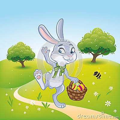 The Easter bunny with a basket full of painted Easter eggs Stock Photo