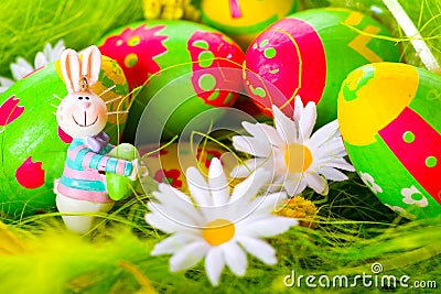 Easter bunny and colorful painted eggs Stock Photo