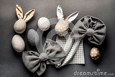 Easter Bunny ears from napkins and eggs. Quail and chicken eggs. Gray textile background. Happy easter Stock Photo
