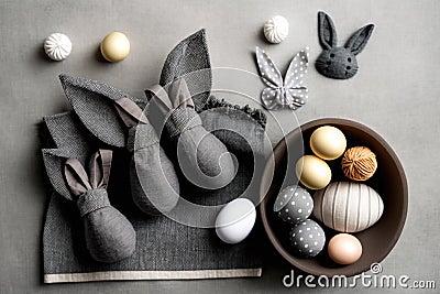 Easter Bunny ears from napkins and eggs. Quail and chicken eggs. Gray textile background. Happy easter Stock Photo