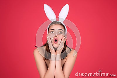 Easter bunny girl wear easter fluffy bunny ears hold easter eggs, isolated studio background. Eater portrait of female Stock Photo