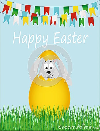 Easter bunny hatched from an egg. A rabbit is sitting in the grass Stock Photo