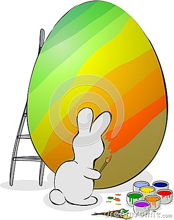 Easter bunny is painting eggs. Stock Photo