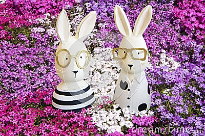 Easter bunnies in pink, violet and white phlox Stock Photo