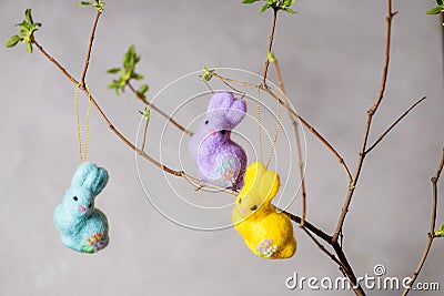 Easter bunnys on a young branch Stock Photo