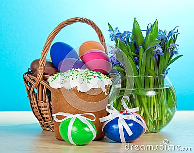 Easter cake, basket with eggs, flowers Stock Photo