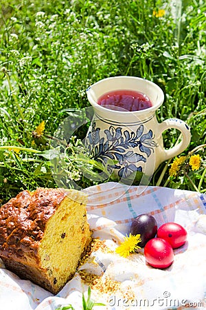 Easter cake, eggs and jug with compote Stock Photo