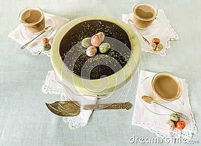 Easter cake with tea matcha decorated chocolate eggs Stock Photo