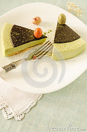 Easter cake with tea matcha decorated chocolate ganache and sweet-stuff eggs Stock Photo