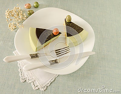 Easter cake with tea matcha decorated chocolate ganache and sweet-stuff eggs Stock Photo