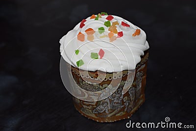 Easter cakes with candied fruit, icing and sprinkles, fresh, side view isolated Stock Photo