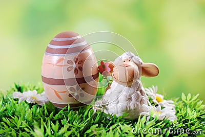 easter-card-cute-lamb-egg-grass-greeting-figurine-66778864.jpg