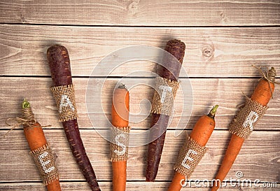 Easter carrots on a wooden background in rustic style Stock Photo