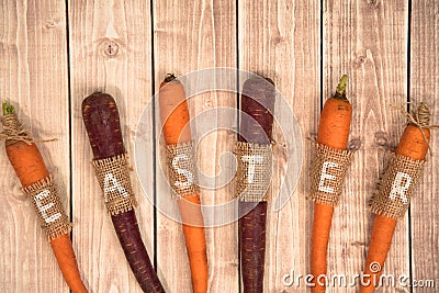 Easter carrots on a wooden background. Stock Photo