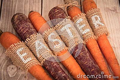 Easter carrots on a wooden background in rustic style Stock Photo