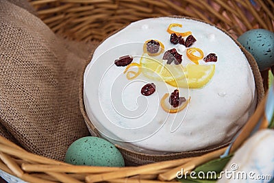 Easter composition of sweet bread, paska and eggs in wicker basket. Holidays breakfast concept Stock Photo