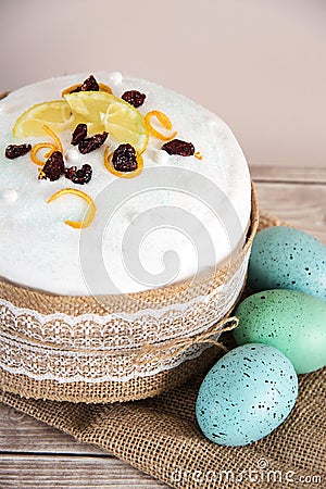 Easter composition of sweet bread, paska and eggs on wooden background. Holidays breakfast concept Stock Photo