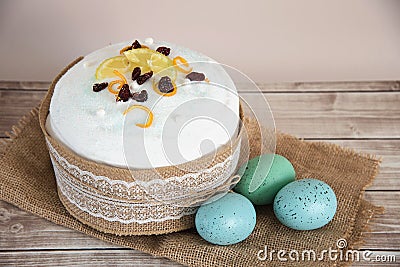 Easter composition of sweet bread, paska and eggs on wooden background. Holidays breakfast concept Stock Photo