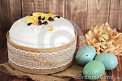 Easter composition of sweet bread, paska and eggs on wooden background. Holidays breakfast concept Stock Photo