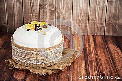 Easter composition of sweet bread, paska on wooden background. Holidays breakfast concept with space for text. Stock Photo