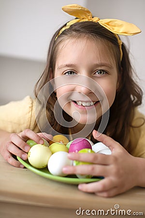 Easter concept. Cute teens girl holding Easter eggs Stock Photo