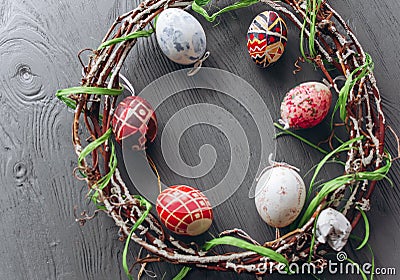 Easter concept . eggs and wreath on a wooden background Stock Photo