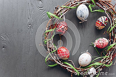 Easter concept . eggs and wreath on a wooden background Stock Photo