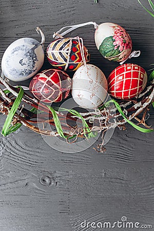 Easter concept . eggs and wreath on a wooden background Stock Photo