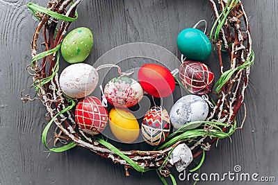 Easter concept . eggs and wreath on a wooden background Stock Photo