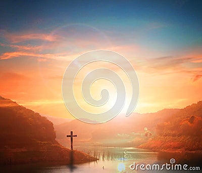 Easter concept:Silhouette cross on Calvary mountain sunset background. Stock Photo