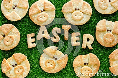 Easter cookies for kids, homemade sugar biscuits shaped funny pigs Stock Photo