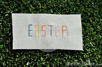 Easter cross stitched on textile Stock Photo