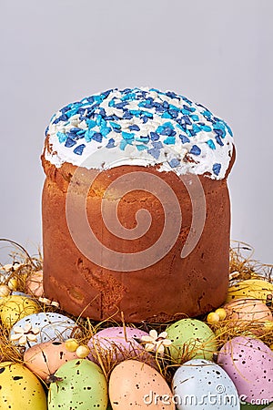 Easter cupcake in a nest of colored eggs. Stock Photo