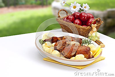 Easter decorated table with lamb and potatos plate Stock Photo