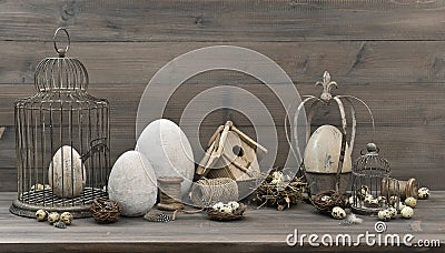 Easter decoration with eggs, nest and vintage birdcage Stock Photo