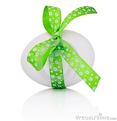 Easter egg with festive green bow isolated on white background Stock Photo