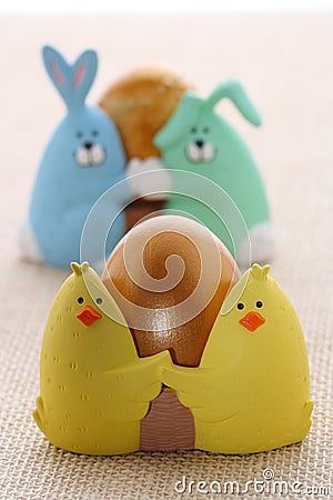Easter egg in funny chick eggcup Stock Photo