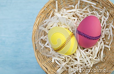 Easter egg in round basket Stock Photo