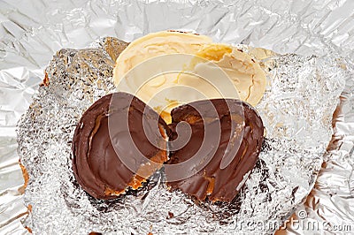 Easter Egg - Stuffed homemade chocolate egg. Isolated on aluminum foil background. Top view Stock Photo