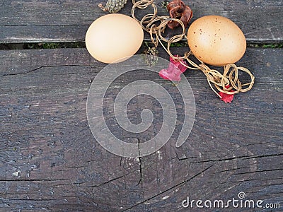 Easter eggs in a basket with decorations on the table Stock Photo