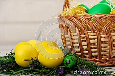 Easter eggs in the basket and with fake grass Stock Photo