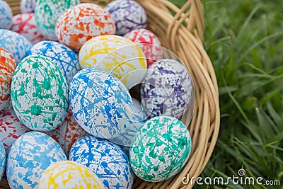 Easter eggs basket on the grass Stock Photo