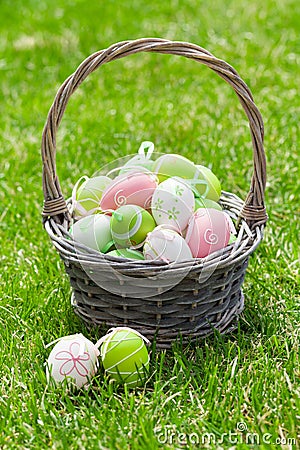 Easter eggs basket on grass Stock Photo