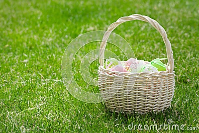 Easter eggs basket on grass Stock Photo