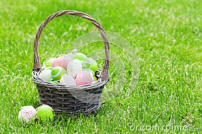 Easter eggs basket on grass Stock Photo