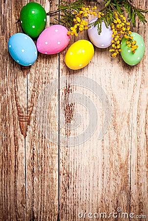 Easter eggs with bunch mimosa copyspace Stock Photo